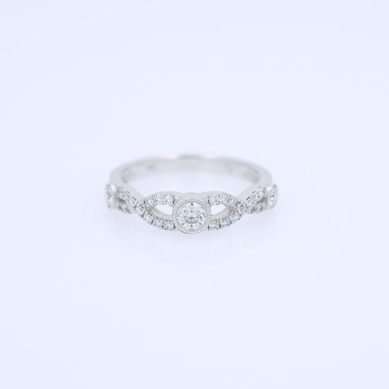 White gold ring with a diamonds on a white background