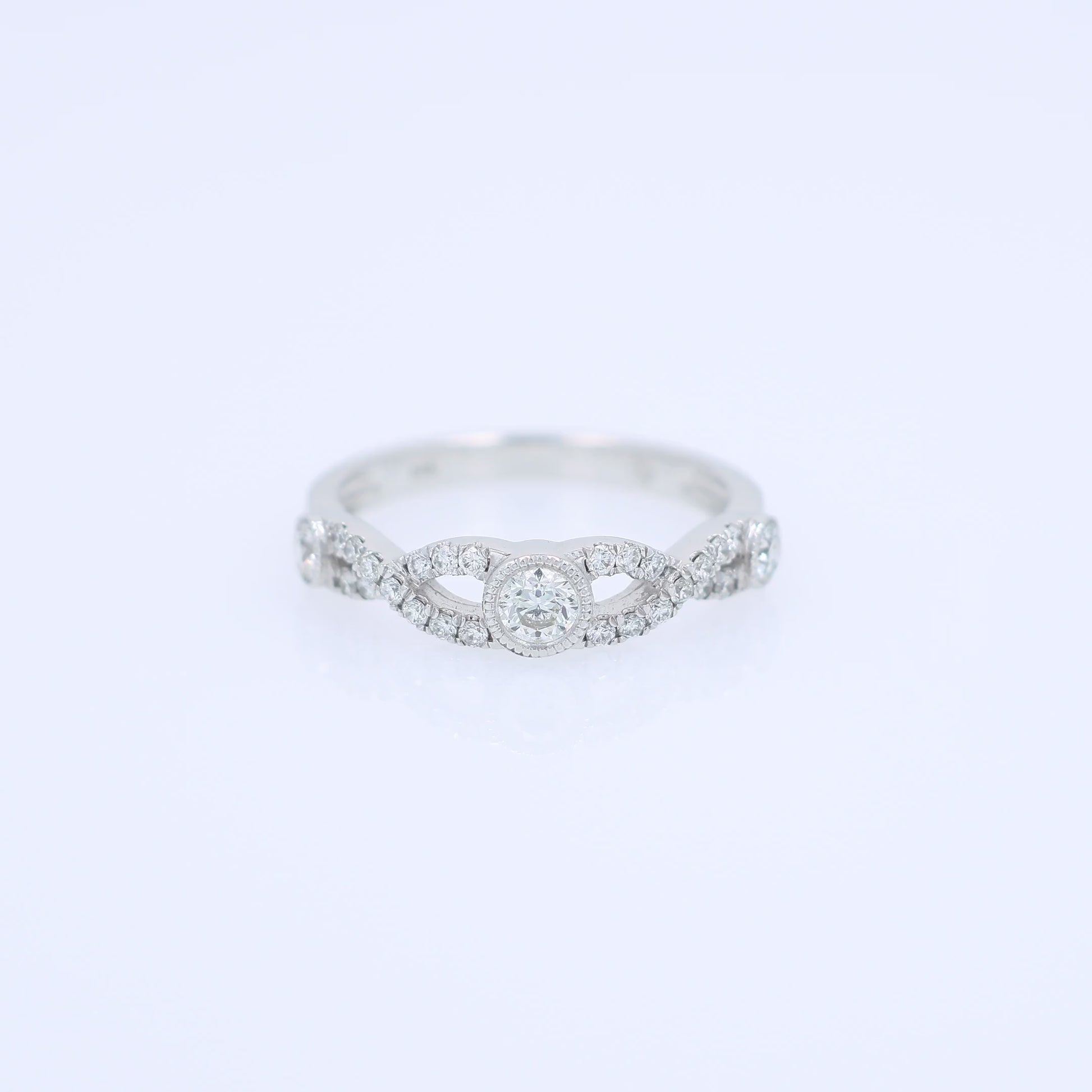 White gold ring with a diamonds on a white background