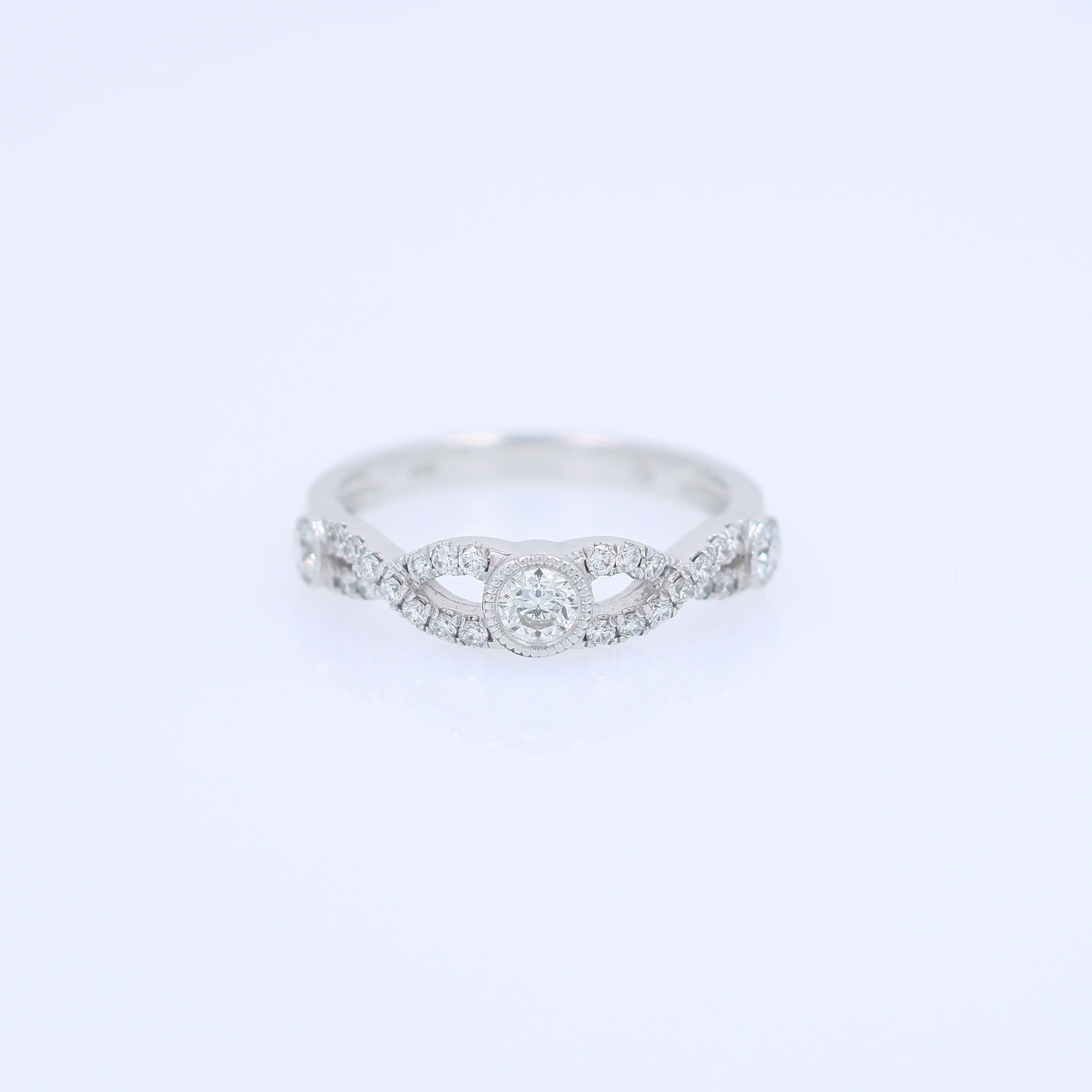White gold ring with a diamonds on a white background