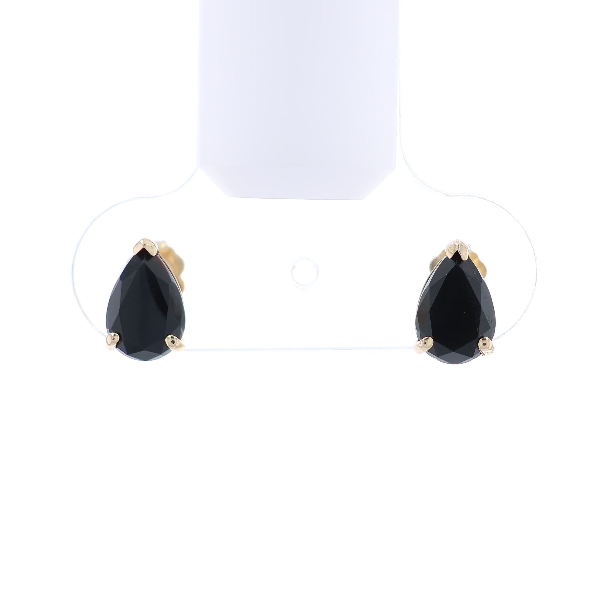 Gold earrings with pear shape faceted black onyx on a white background