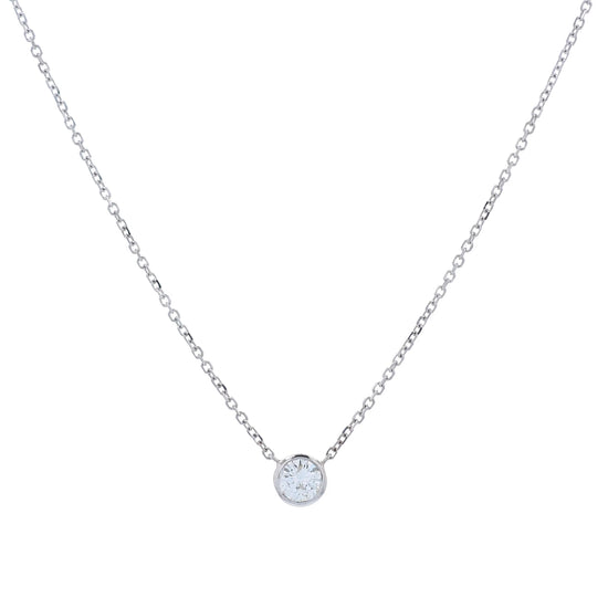 A delicate white gold chain necklace with a single round bezel-set diamond pendant, displayed on a clean white background.