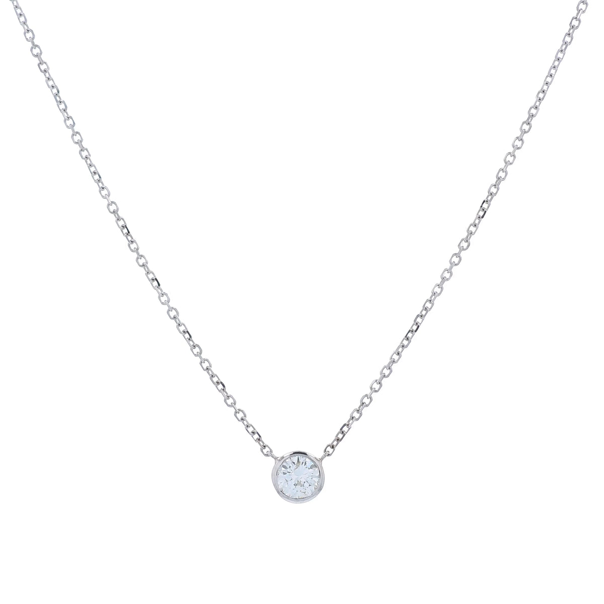 A delicate white gold chain necklace with a single round bezel-set diamond pendant, displayed on a clean white background.