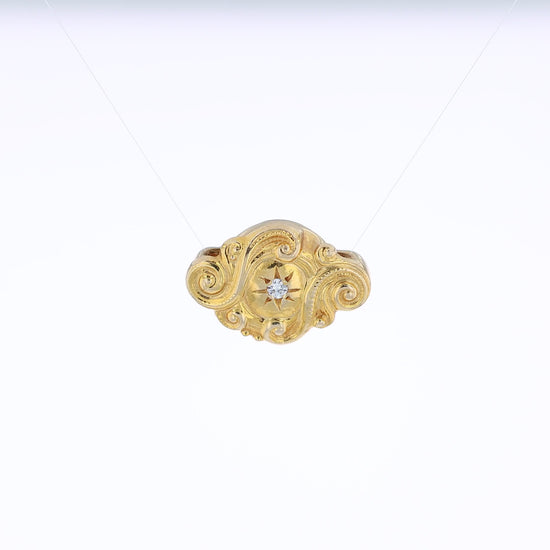Yellow gold diamond Victorian slide pendant with a swirl design on a white background