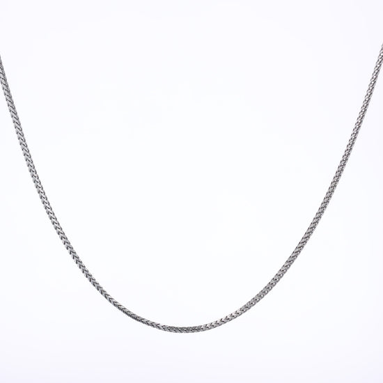 White gold franco link chain necklace on a white background