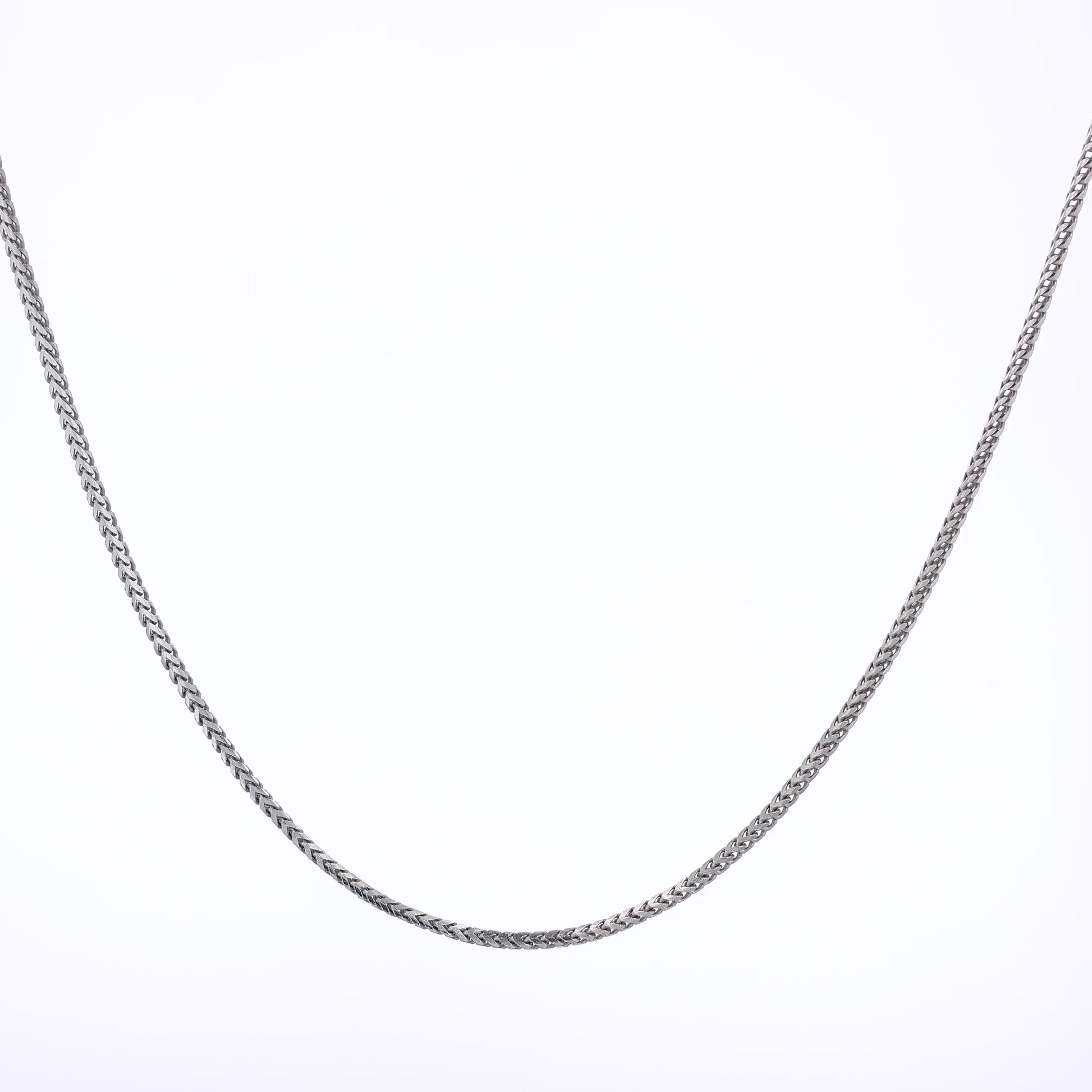 White gold franco link chain necklace on a white background