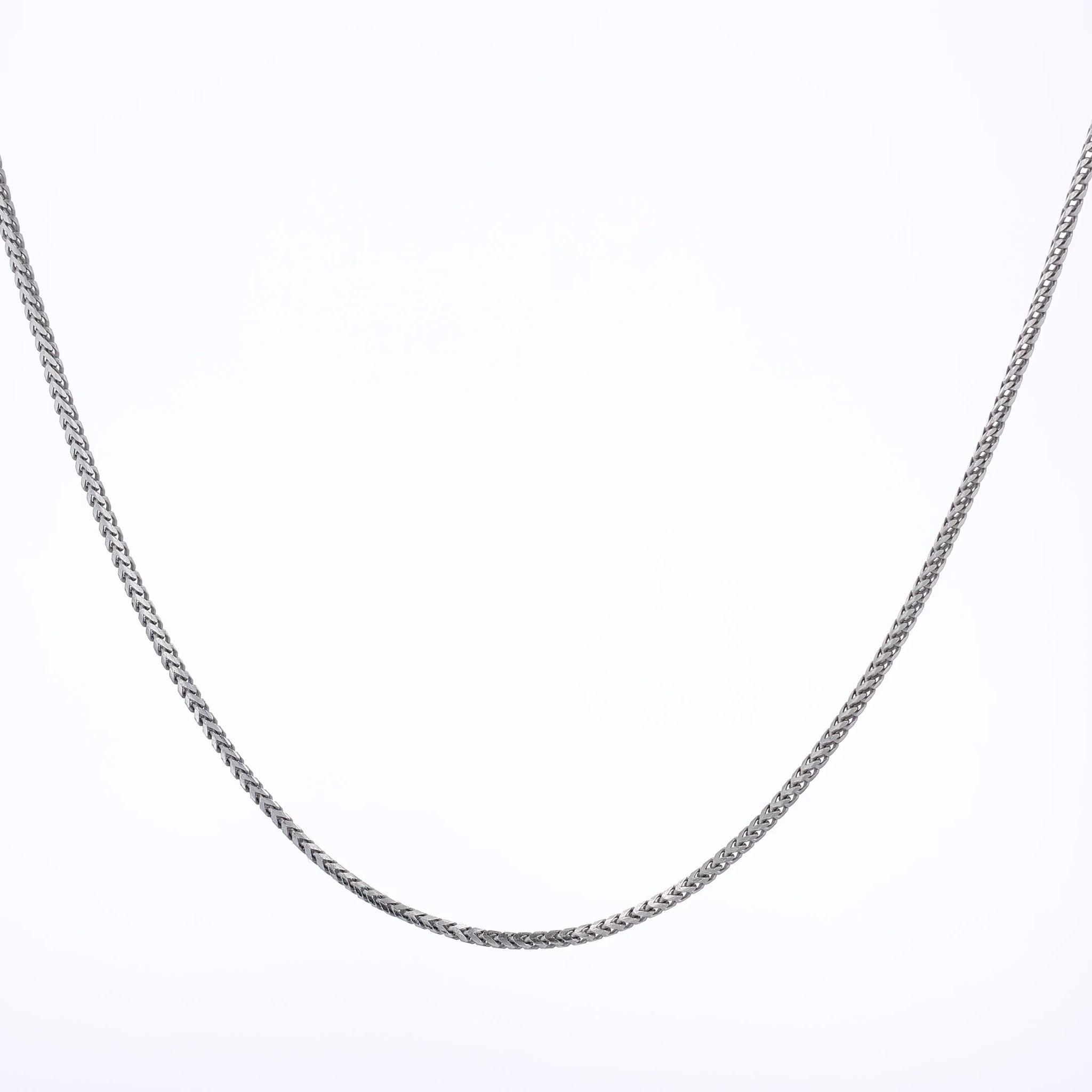 White gold franco link chain necklace on a white background
