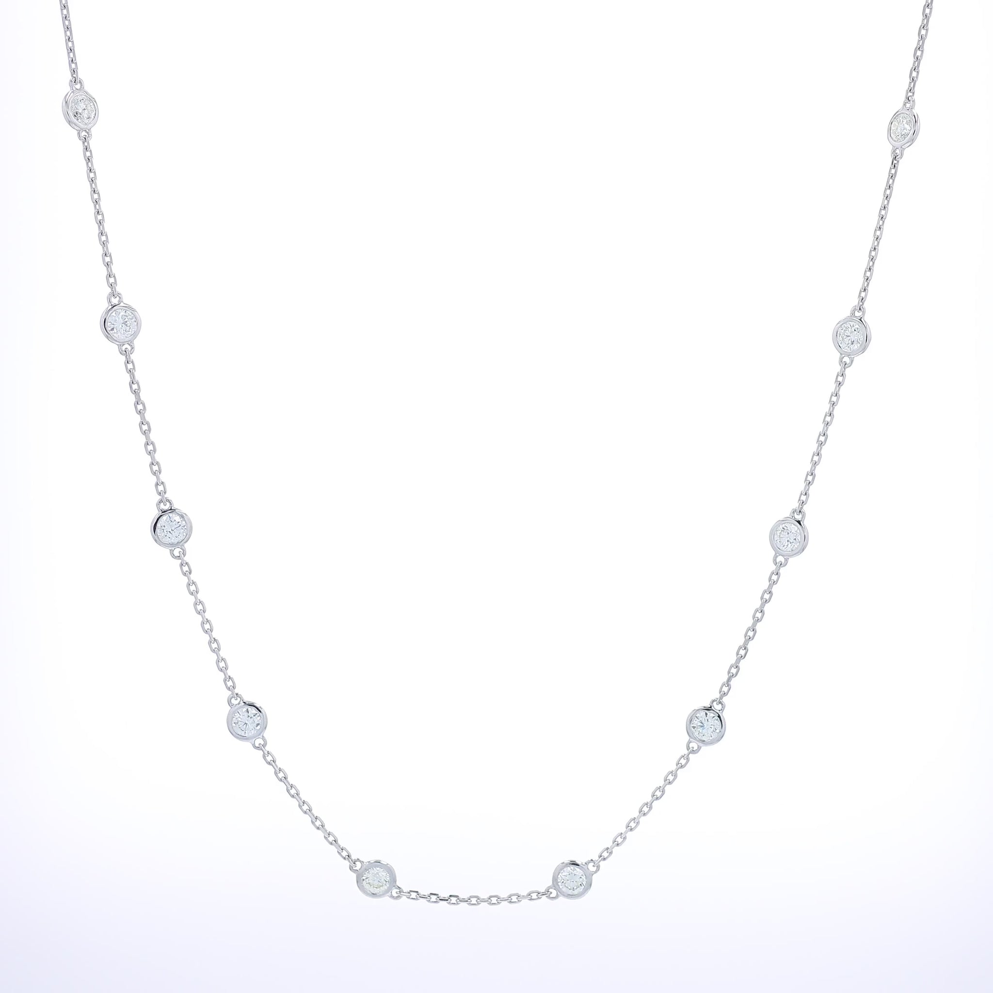 White gold bezel set Diamonds By The Yard station necklace on a white background