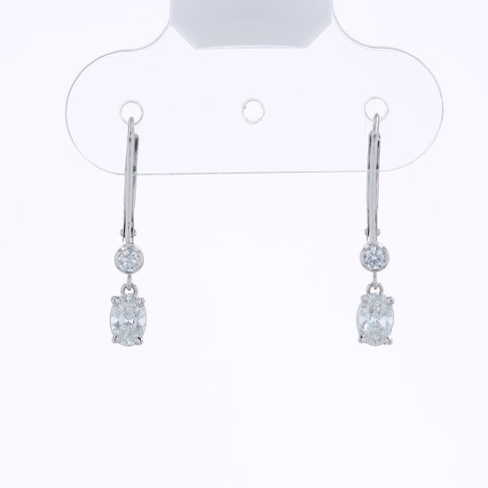White gold round and oval diamond drop earrings on a white background