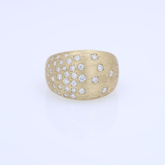 Gold ring with embedded diamonds on a white background