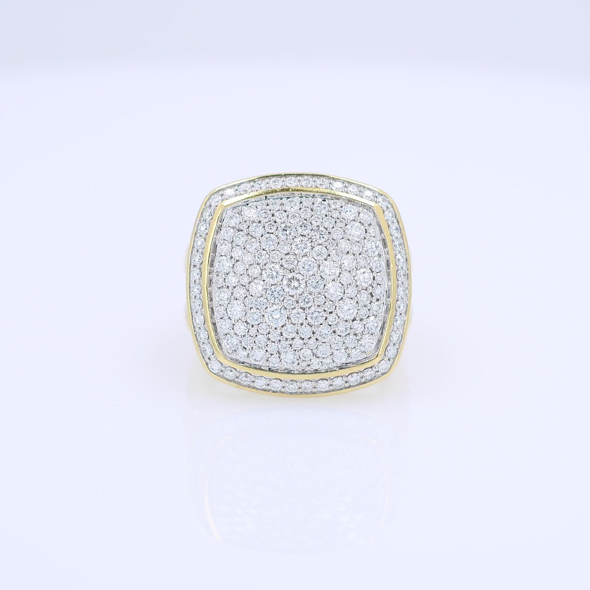 A video of a yellow gold David Yurman signet ring featuring a square-shaped pavé diamond face and a twisted cable band, set against a clean white background.