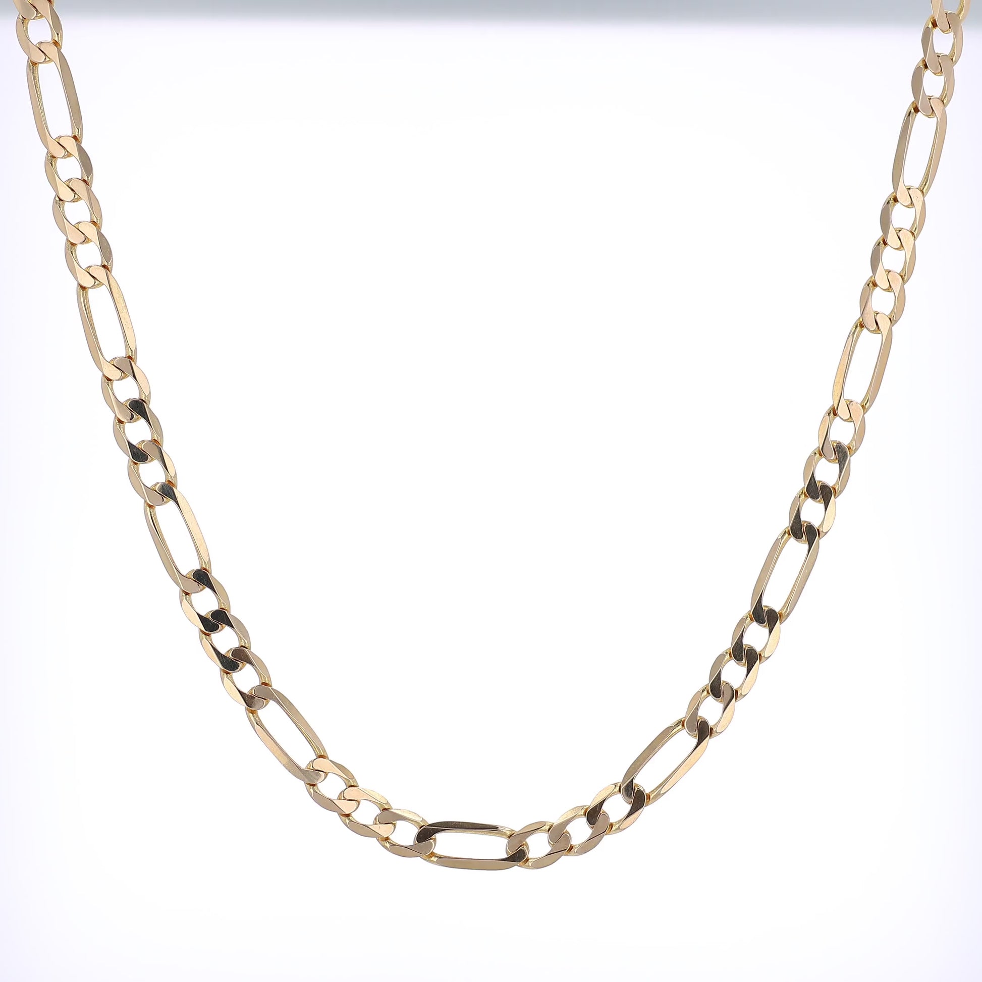 360 degree video of a yellow gold figaro link chain necklace on a white background