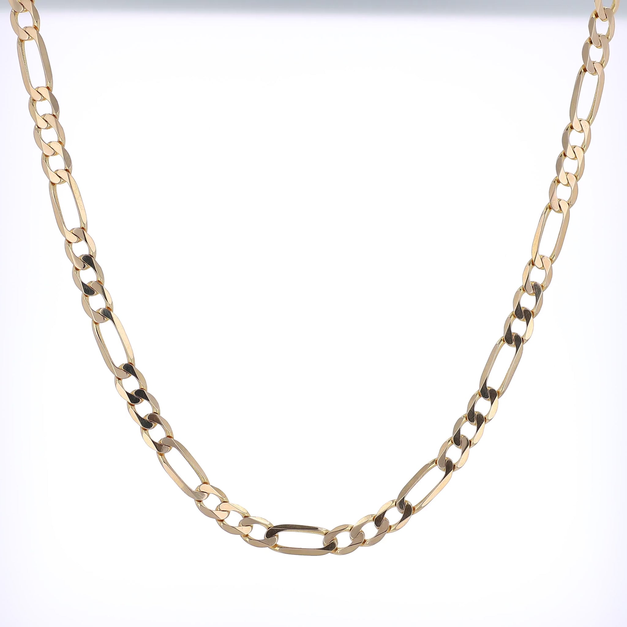 360 degree video of a yellow gold figaro link chain necklace on a white background