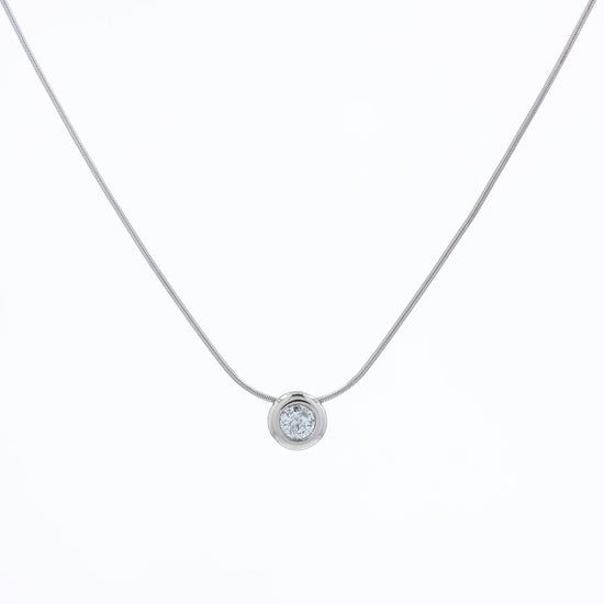 A delicate gold snake chain necklace with a single round bezel-set diamond pendant, displayed against a clean white background.