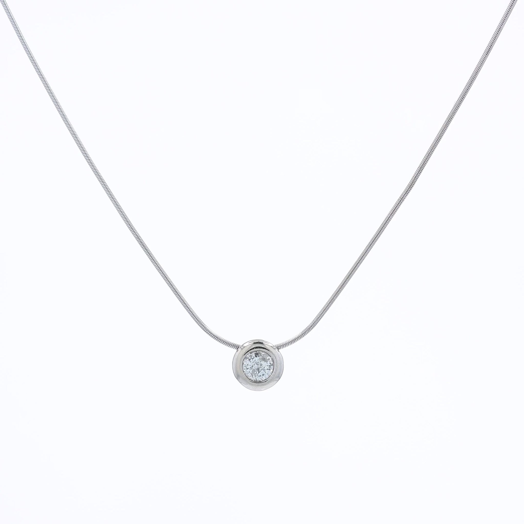 A delicate gold snake chain necklace with a single round bezel-set diamond pendant, displayed against a clean white background.