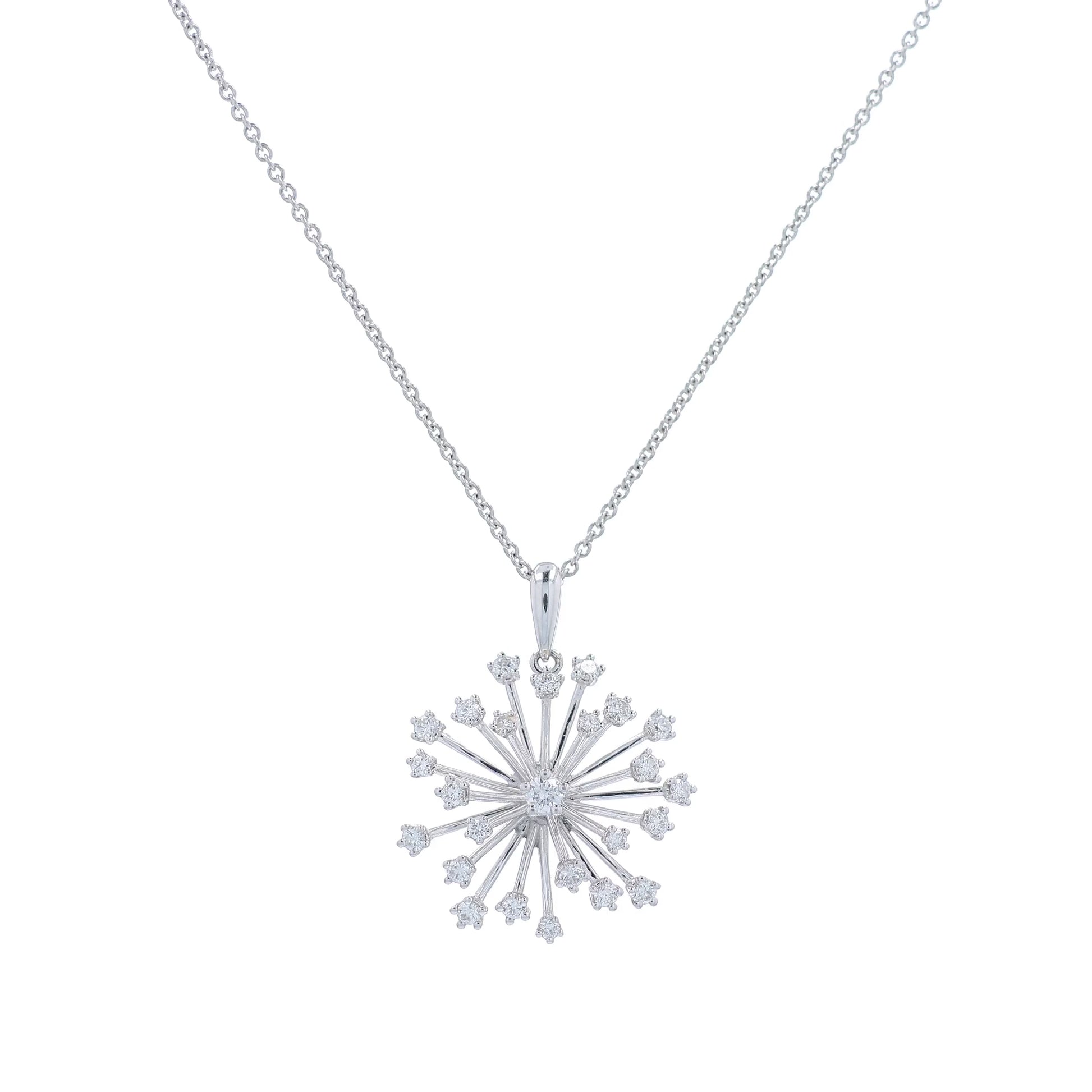 White gold starburst design diamond pendant necklace on a white background