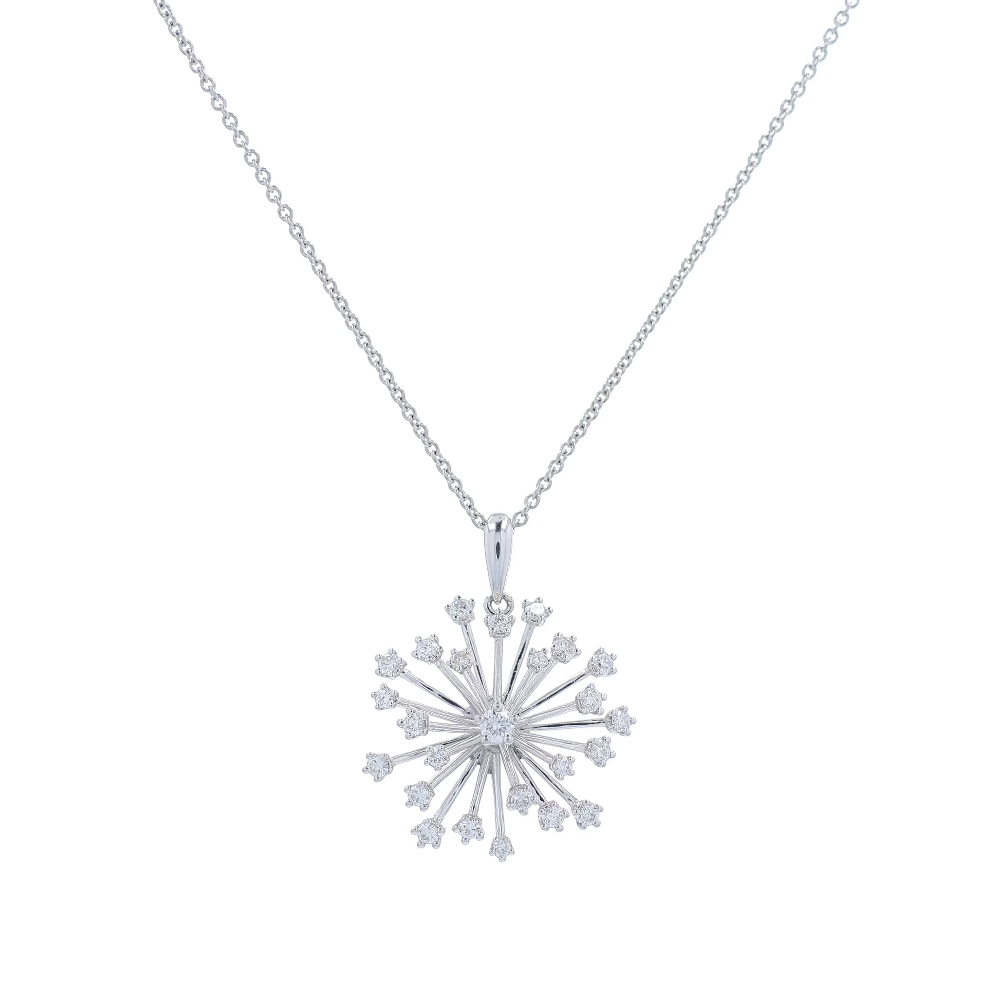 White gold starburst design diamond pendant necklace on a white background