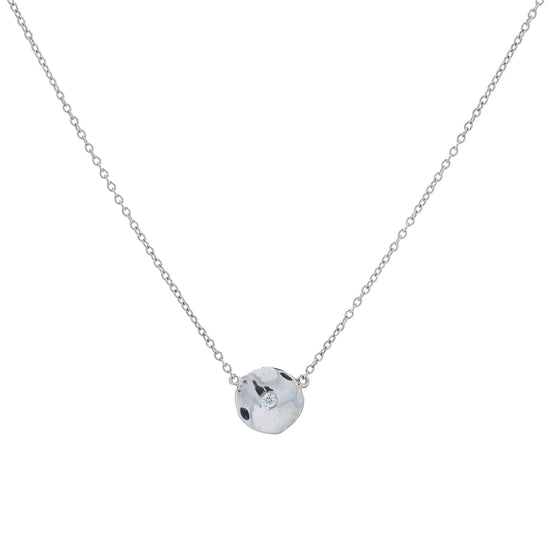 White gold wavy disc design diamond pendant necklace on a white background