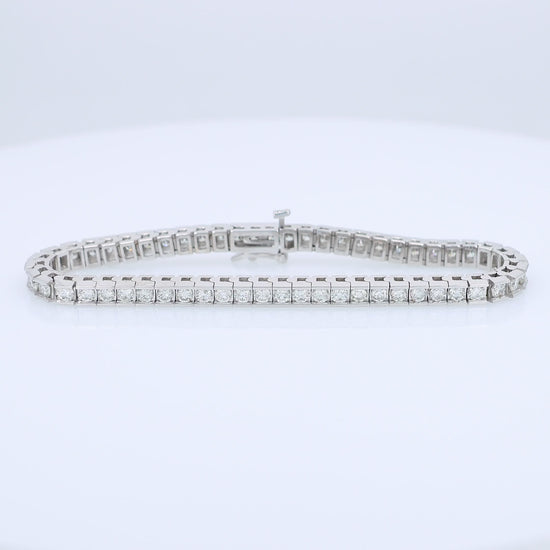 White gold channel set 5 carat diamond tennis bracelet on a white background
