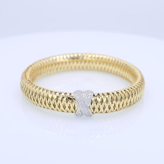 Roberto Coin two-tone gold diamond "X" link flex tubogas bracelet on a white background