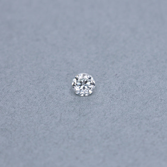 Transitional round 1.02 carat diamond graded GI1 on a grey background