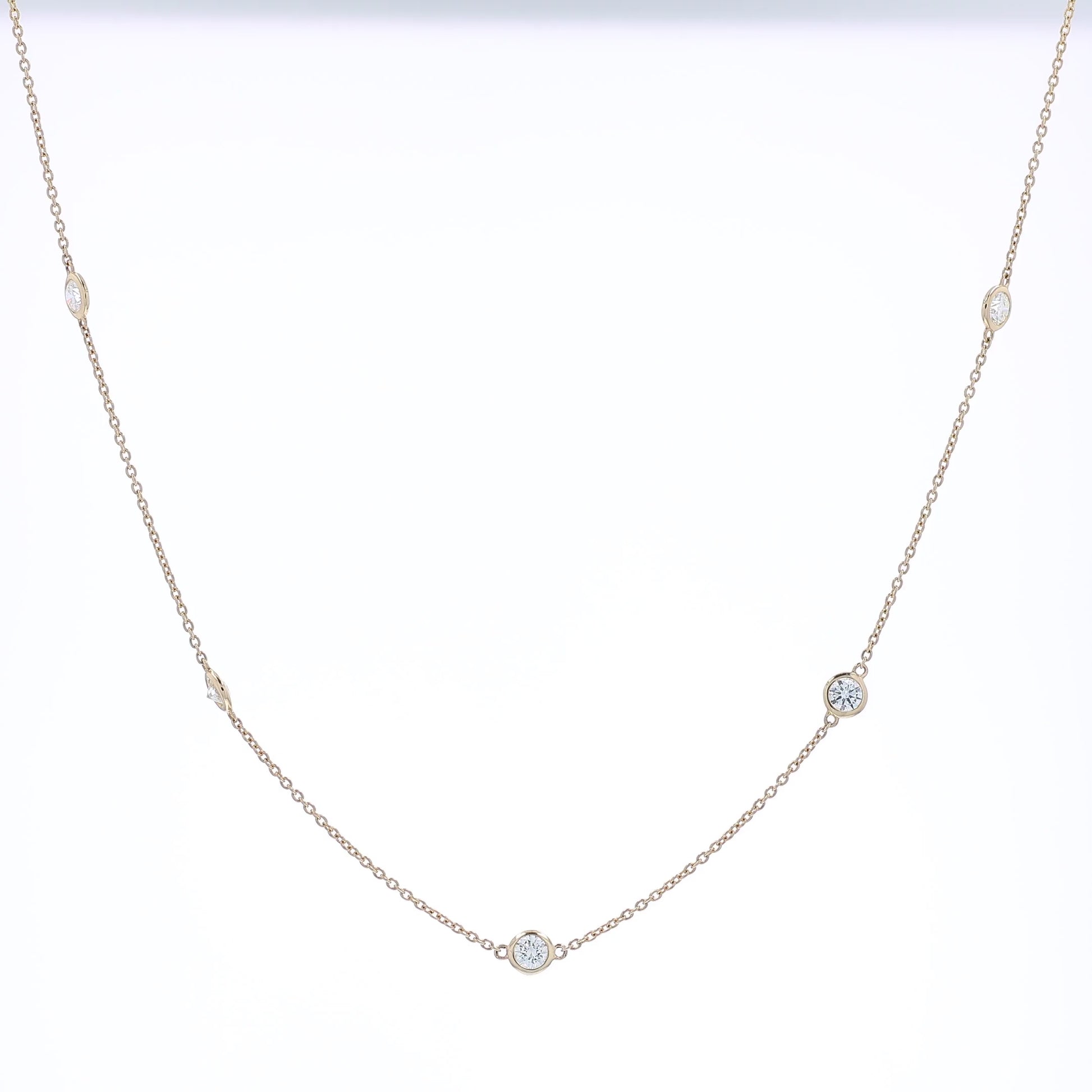 Yellow gold Diamonds By The Yard diamond station necklace on a white background