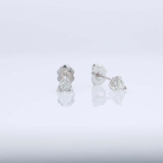 White gold trillion cut diamond stud earrings totaling 0.31 carats on a white background