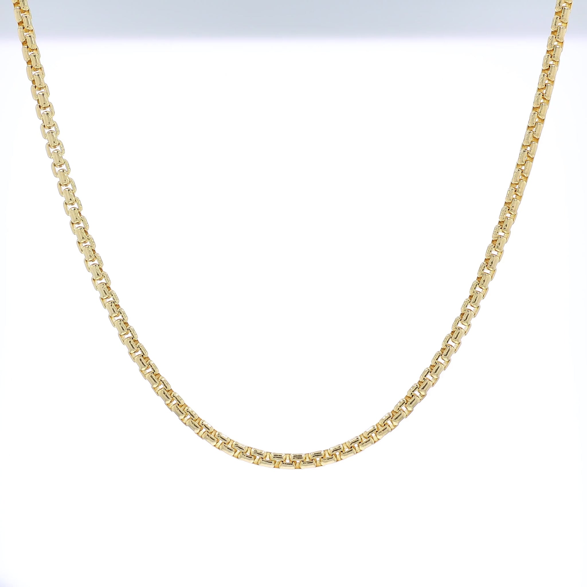 Yellow golf 3.8mm polished box link chain necklace on a white background
