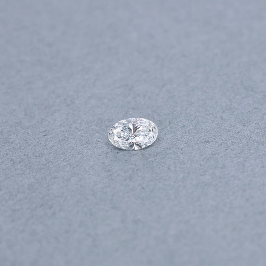Oval 1.01 carat GIA certified diamond graded FSI2 on a grey background