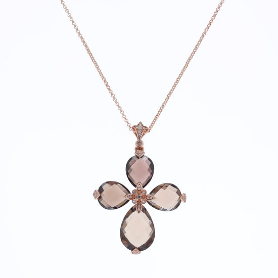 Rose gold faceted pear shape smoky topaz and diamond cross necklace on a white background