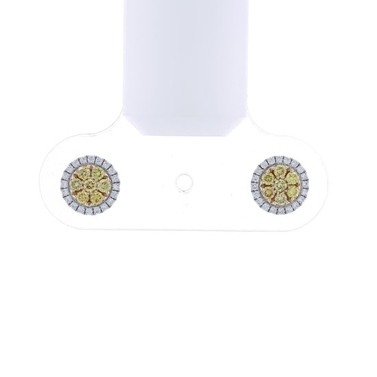 White gold stud earrings with yellow and white diamond clusters on a white background