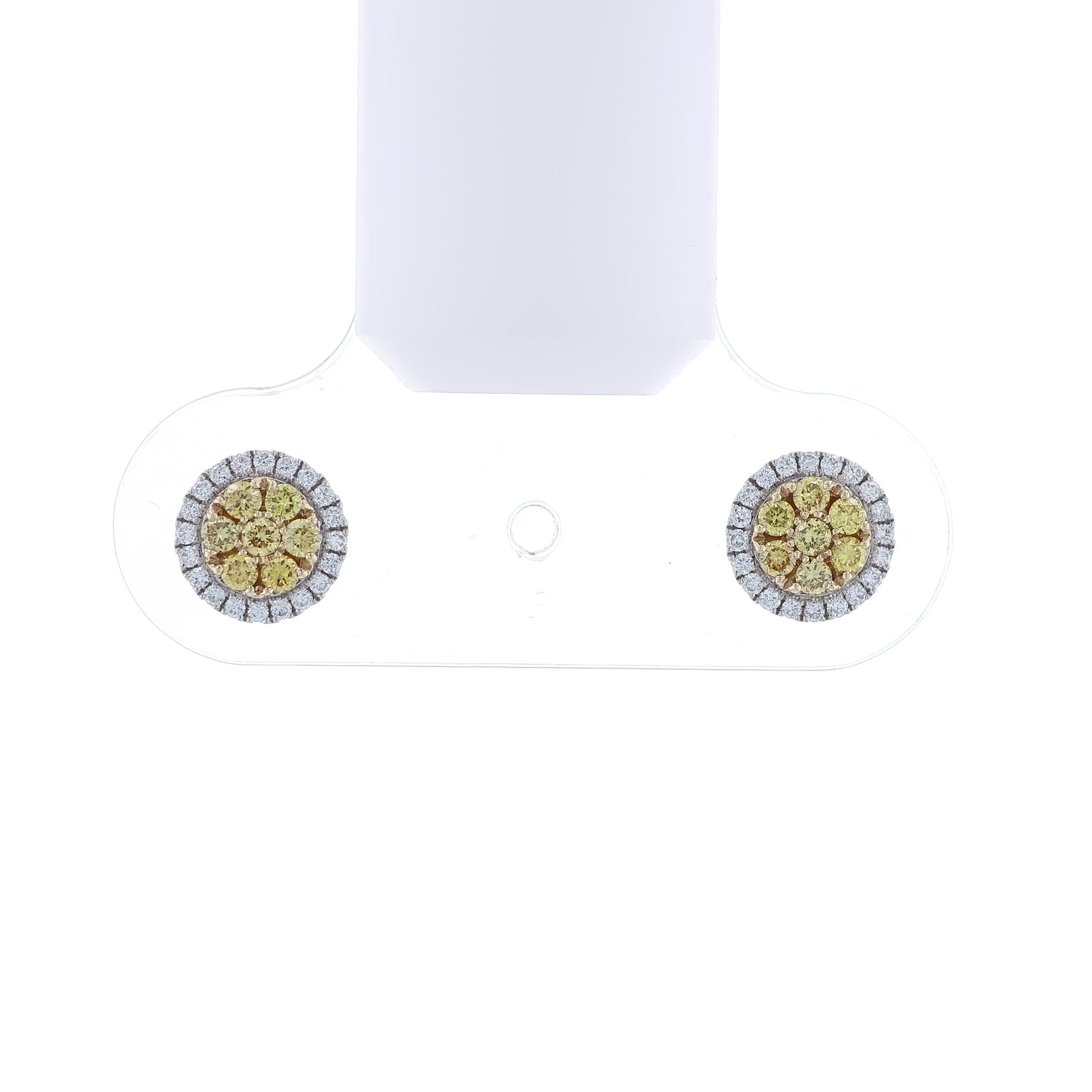 White gold stud earrings with yellow and white diamond clusters on a white background