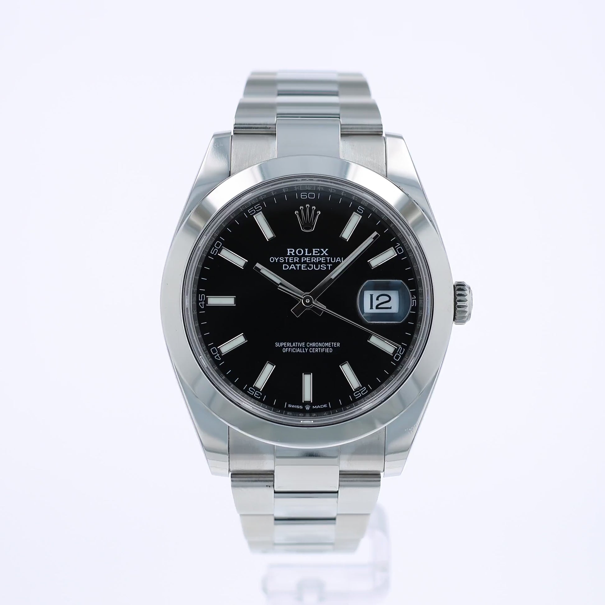 360 degree video of a silver Rolex watch with a black dial on a white background