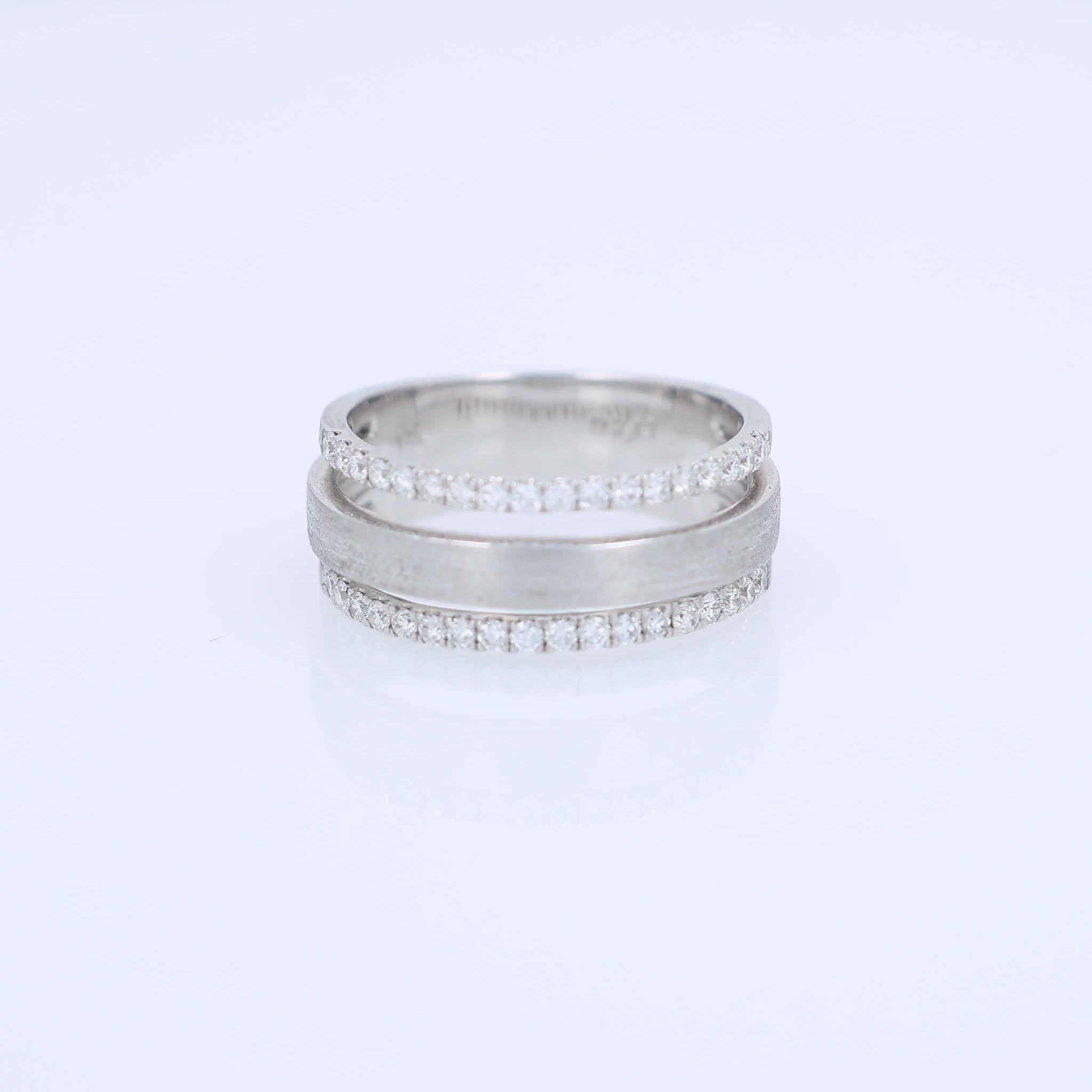 3 row brushed white gold diamond ring on a white background