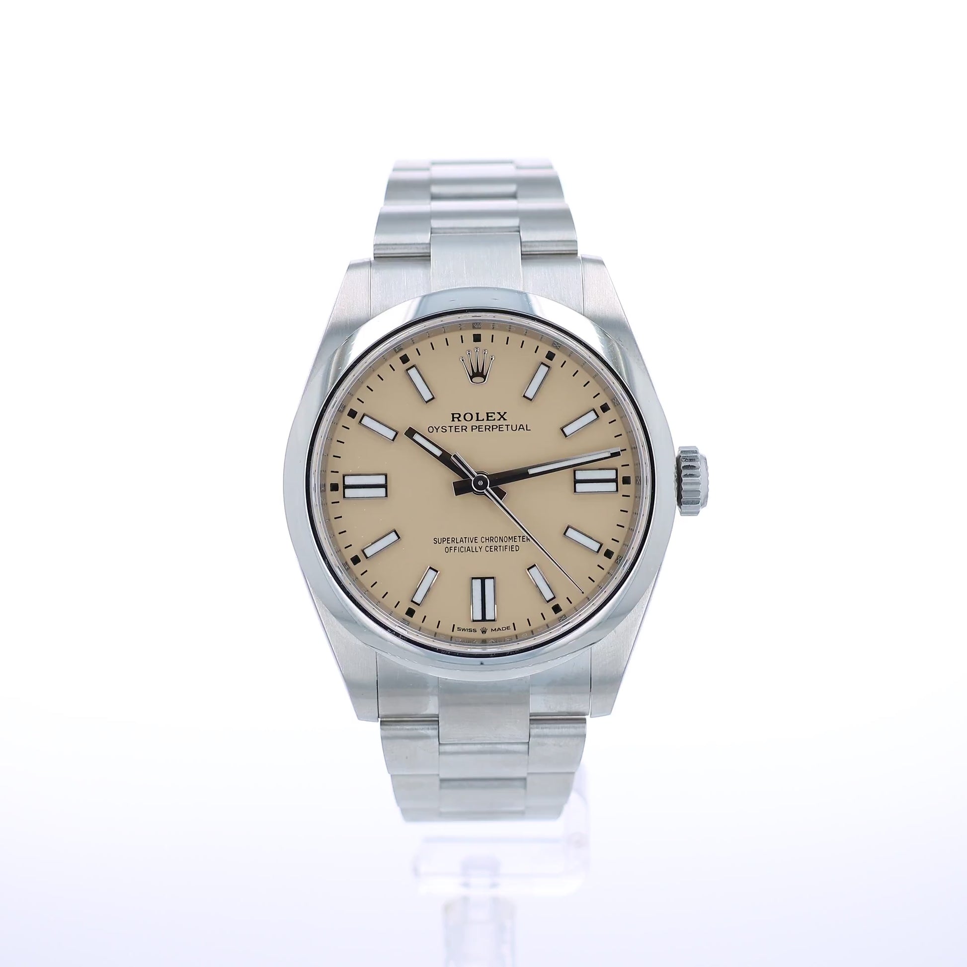 A Rolex Oyster Perpetual watch with a stainless steel bracelet and a beige dial, shown against a plain white background.