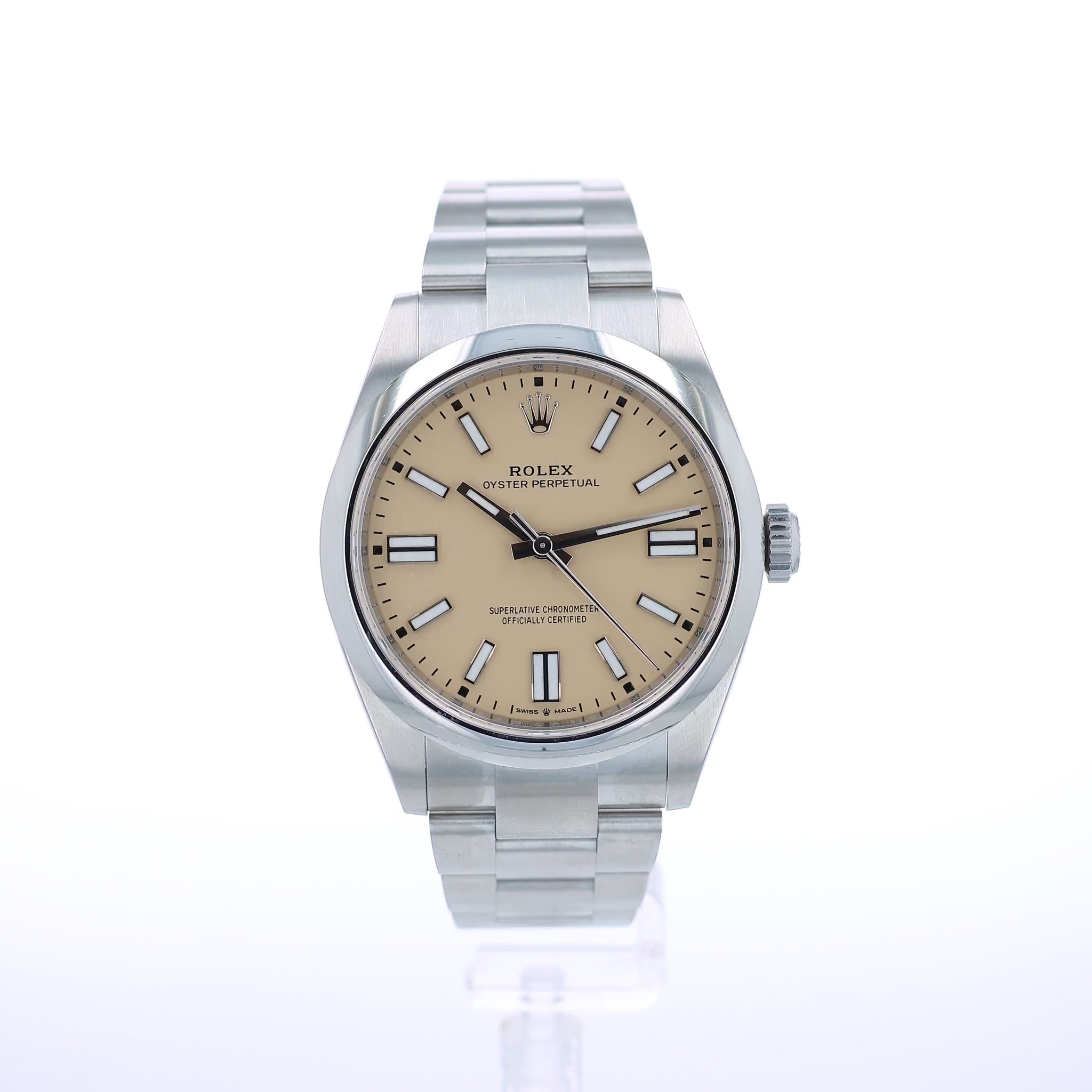 A Rolex Oyster Perpetual watch with a stainless steel bracelet and a beige dial, shown against a plain white background.