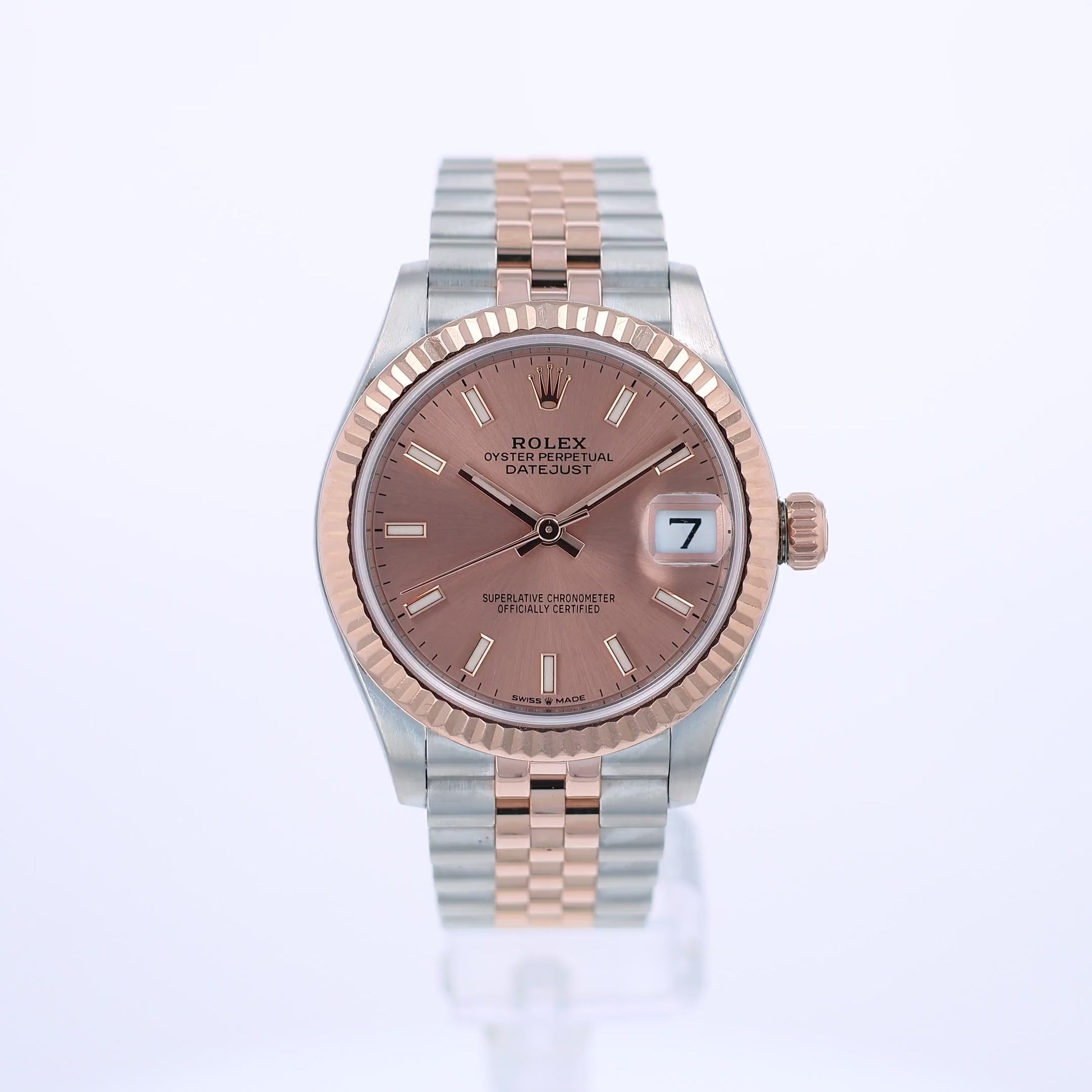 360 video of a rose gold and steel Rolex watch with a pink dial on a white background
