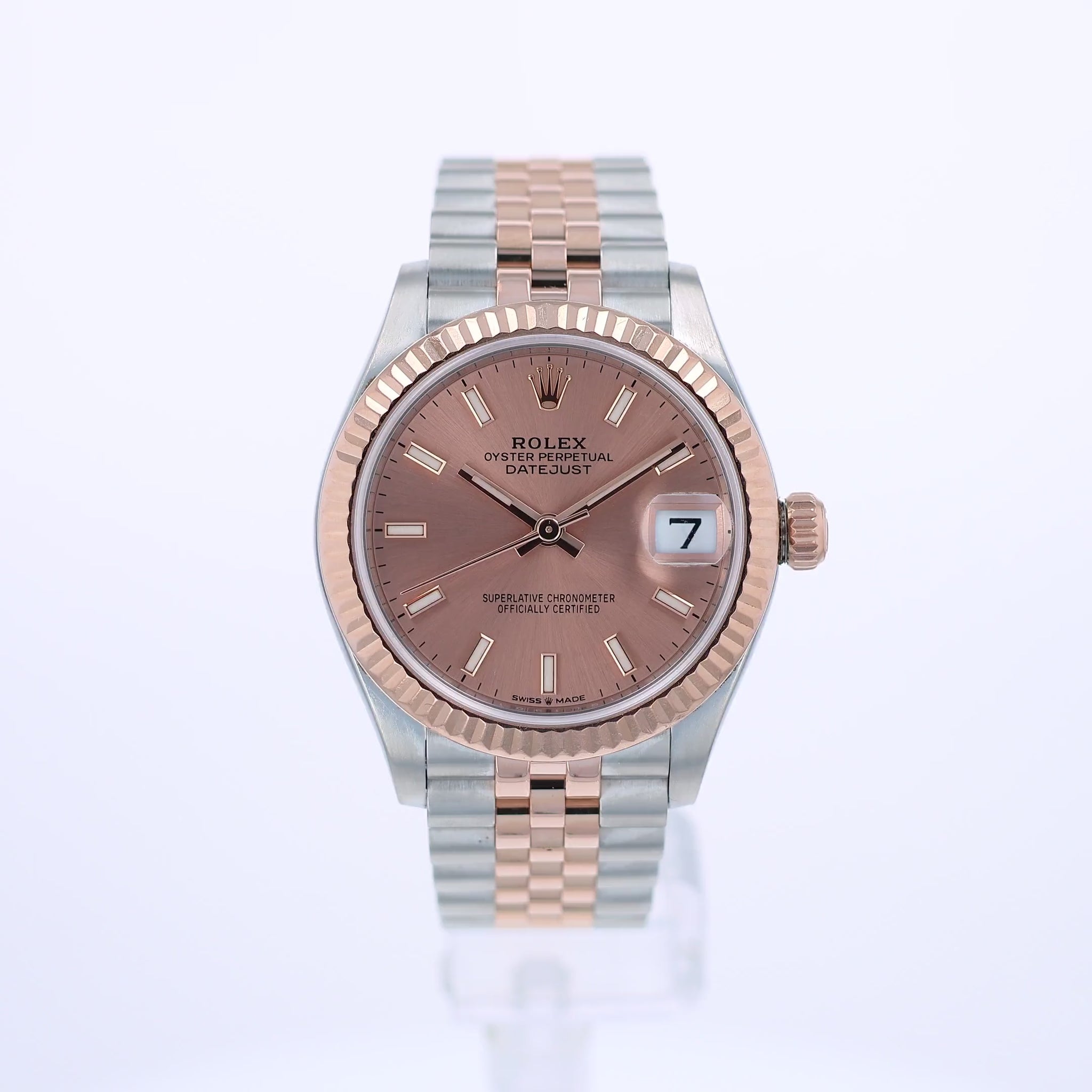 360 video of a rose gold and steel Rolex watch with a pink dial on a white background