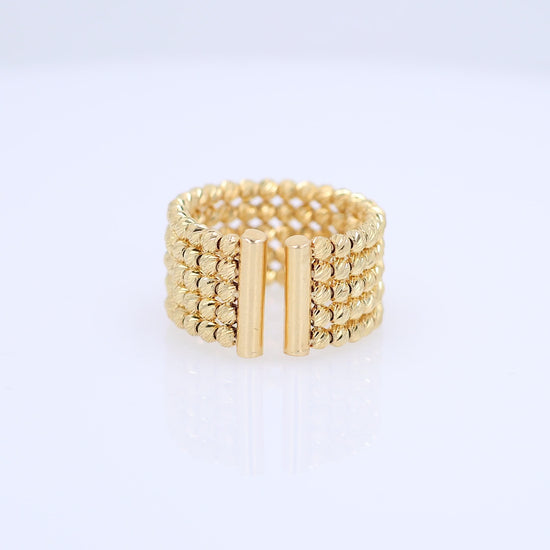 A video of a wide gold-plated multi-row beaded ring with two vertical gold bars in the front, displayed on a clean white background.