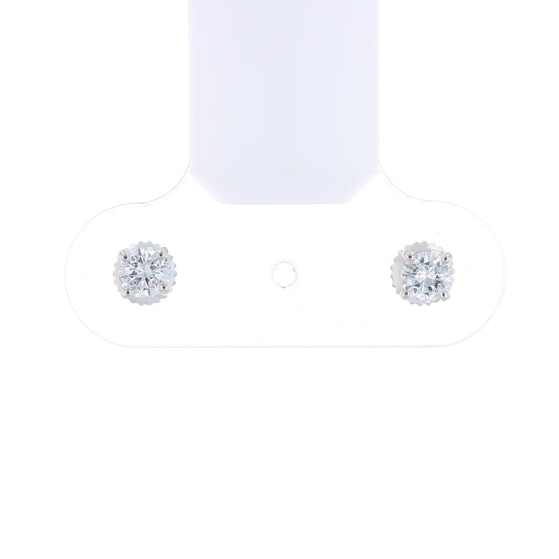 Pair of white gold round diamond stud earrings on a white background