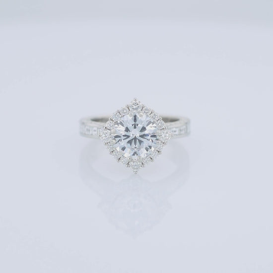 Platinum diamond halo engagement ring with diamond accents and a round cubic zirconia center on a white background