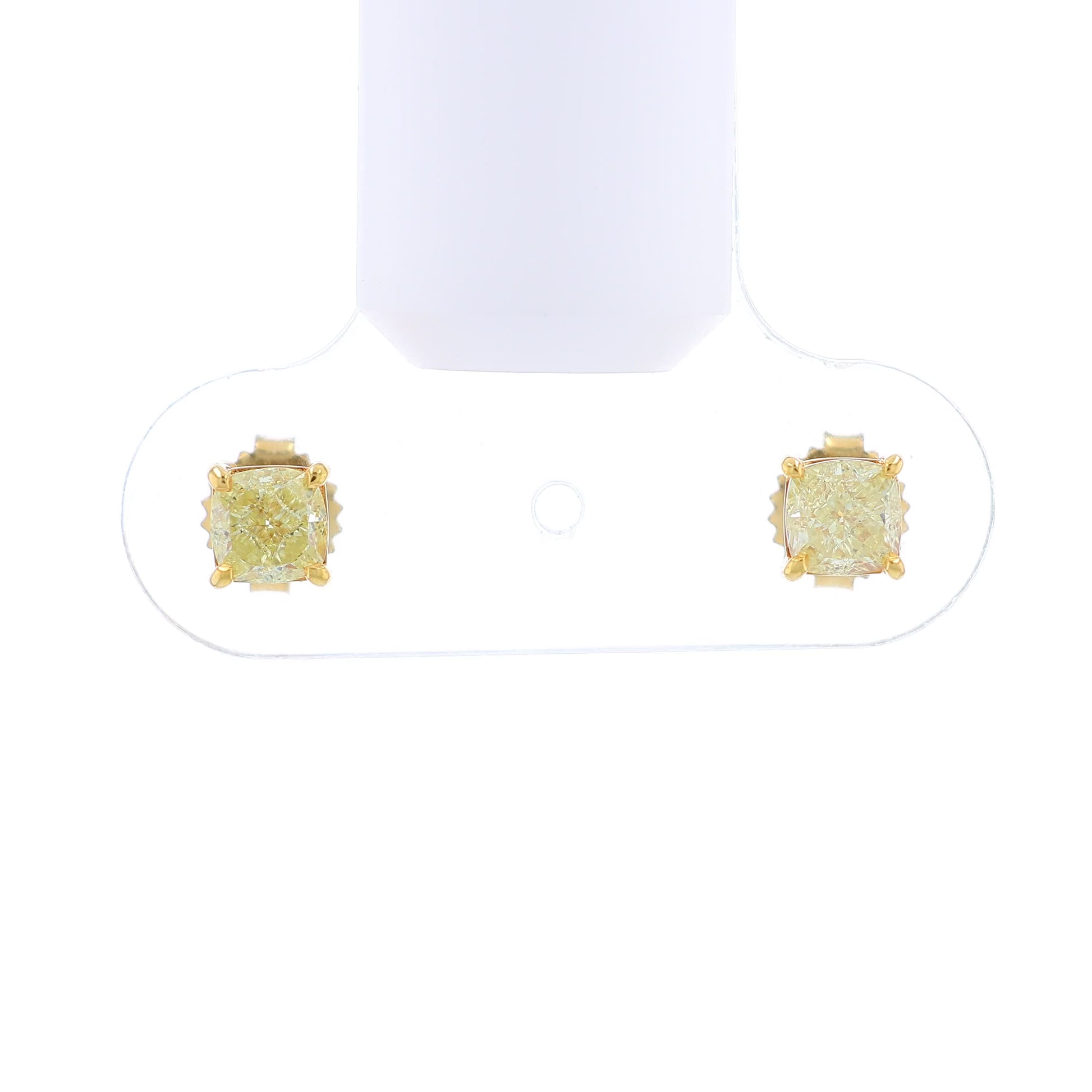 Video of a pair of yellow gold stud earrings with cushion-cut fancy yellow diamonds on a white background