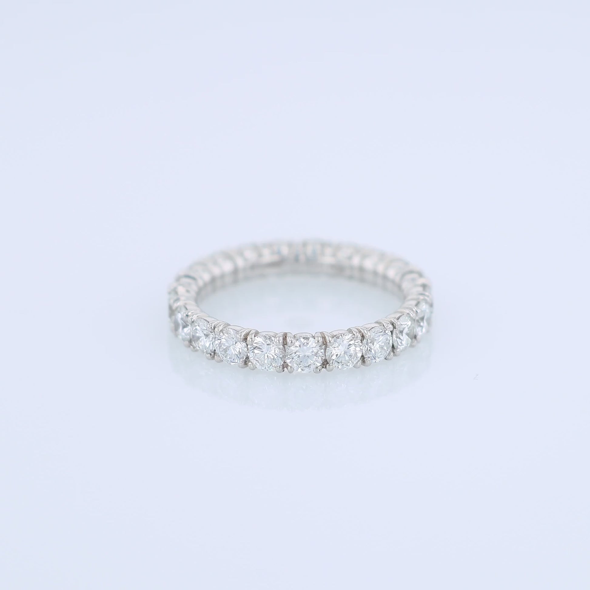 Platinum diamond eternity band on a white background