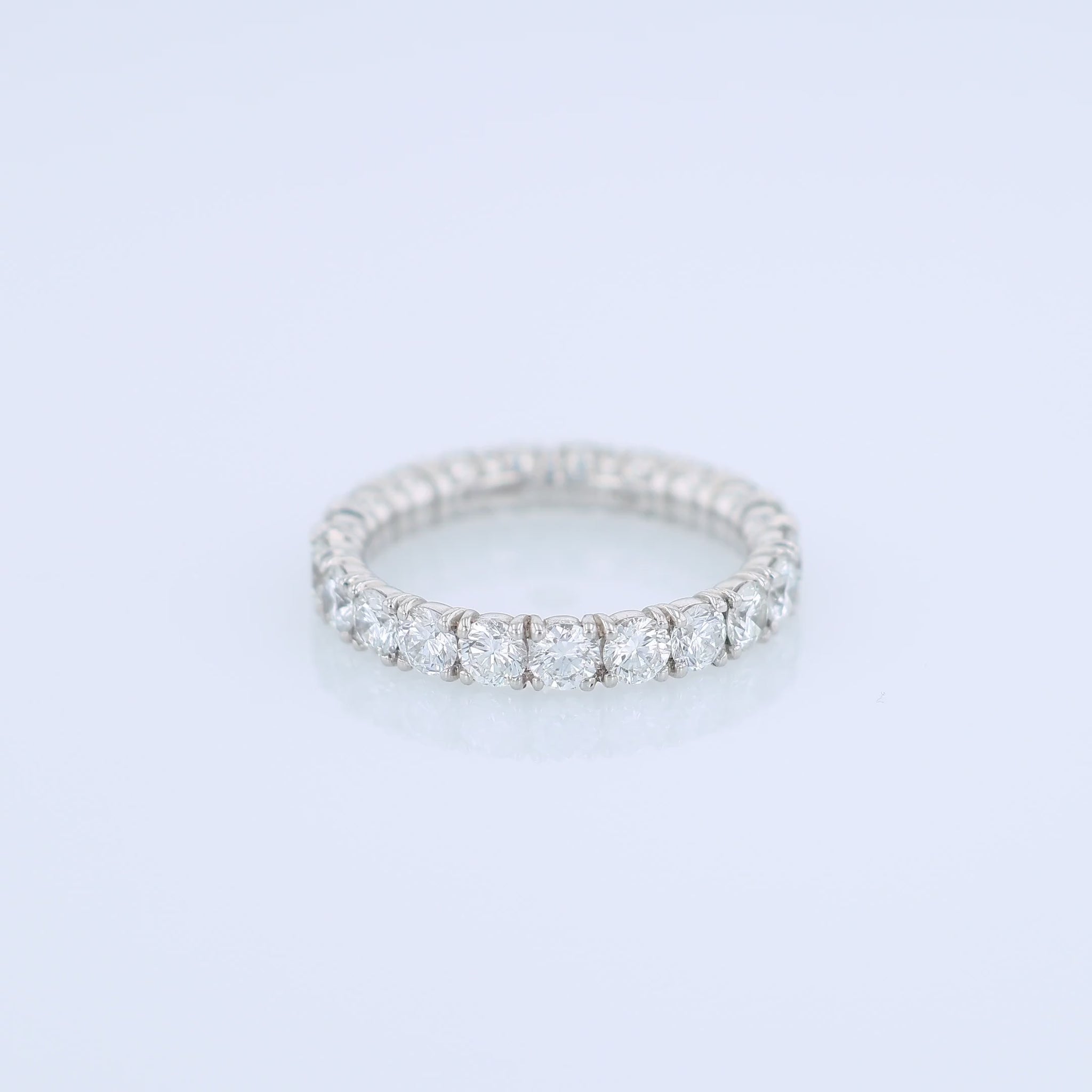Platinum diamond eternity band on a white background