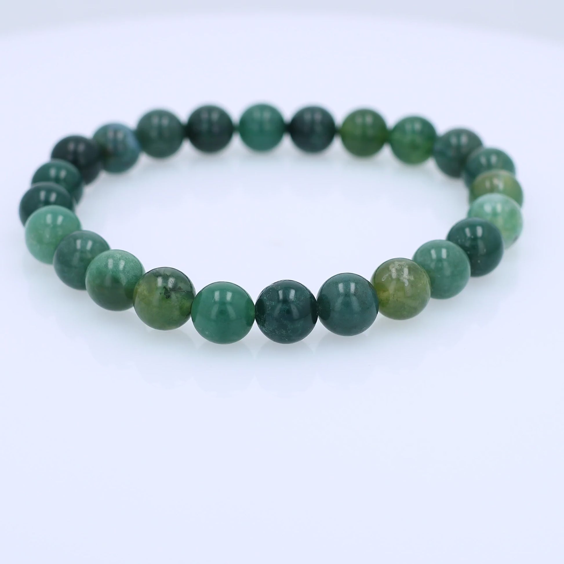 Green Beaded Bracelet spinning on a white background