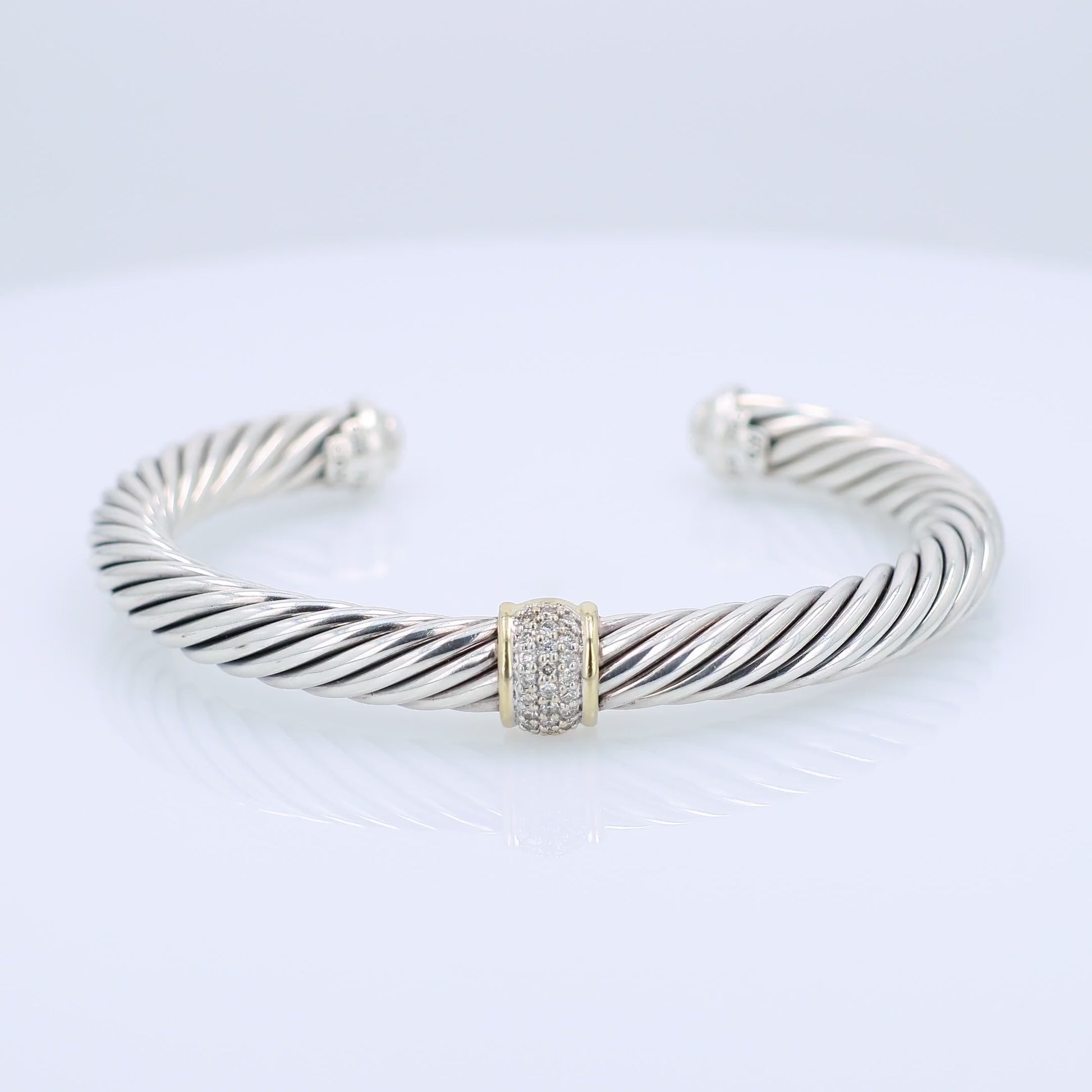 David Yurman silver and gold diamond station cuff bracelet on a white background