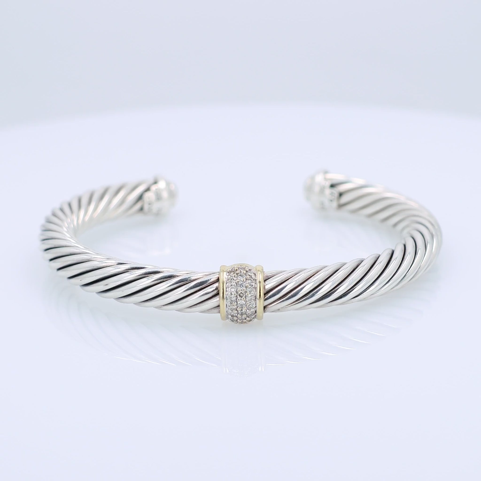 David Yurman silver and gold diamond station cuff bracelet on a white background