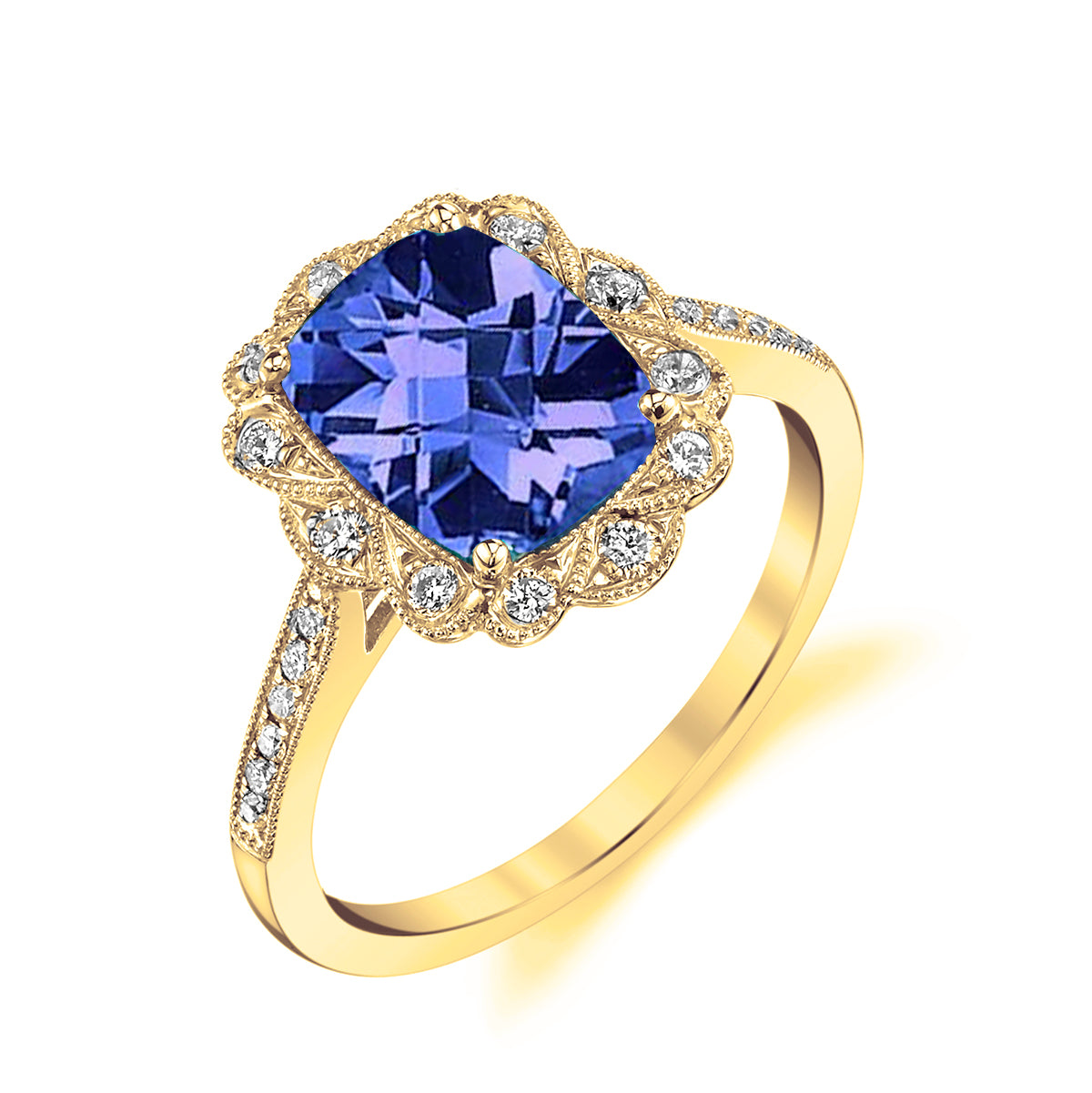 A yellow gold ring featuring a large cushion-cut blue tanzanite center stone, surrounded by a scalloped halo of small clear diamonds and an engraved shank with additional diamonds, shown on a white background.