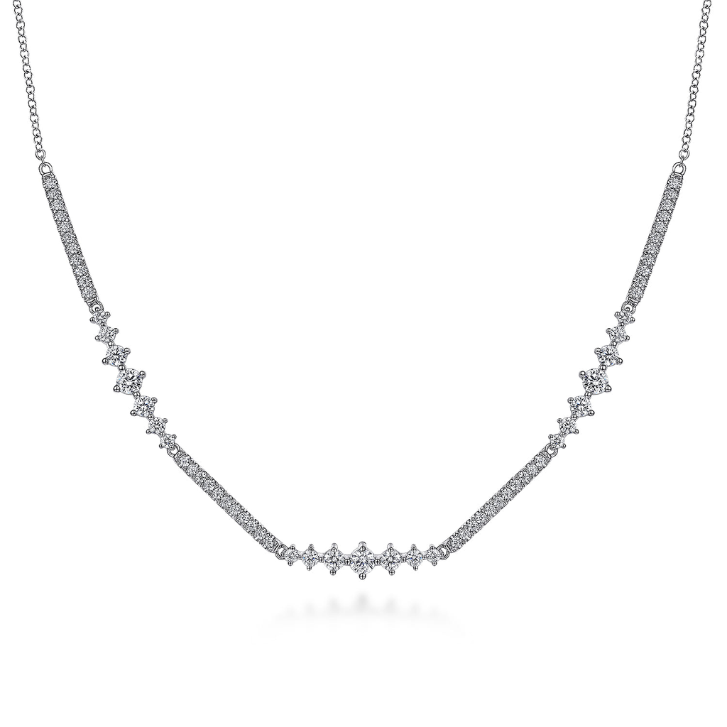 silver necklace with clear stones on white background