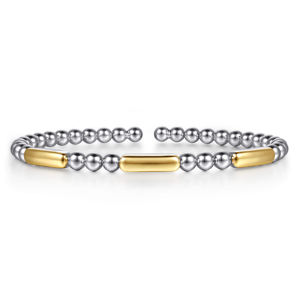 Two beaded bracelets with gold accents on a white background