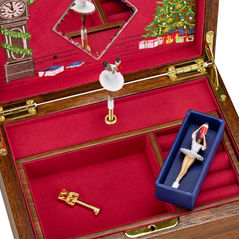 Wooden jewelry box with red interior, gold key, and  2 small figure of a ballerinas